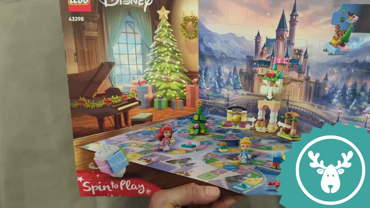 Die Box lässt sich nach unten aufklappen und verwandelt sich in ein Brettspiel mit winterlicher Schlosskulisse.