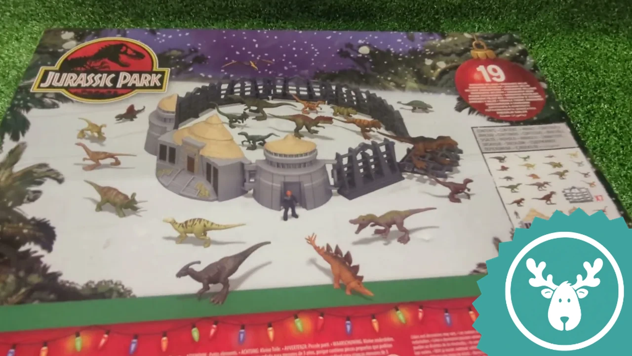Auf der Rückseite ist zu sehen, wie das fertige Spielset mit Dinosauriern und Gehege aufgebaut aussieht.