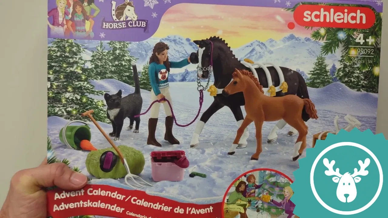 Die Vorderseite des Horse Club Adventskalenders zeigt ein stimmungsvolles Wintermotiv mit Reiterin Lisa und ihren Pferden.